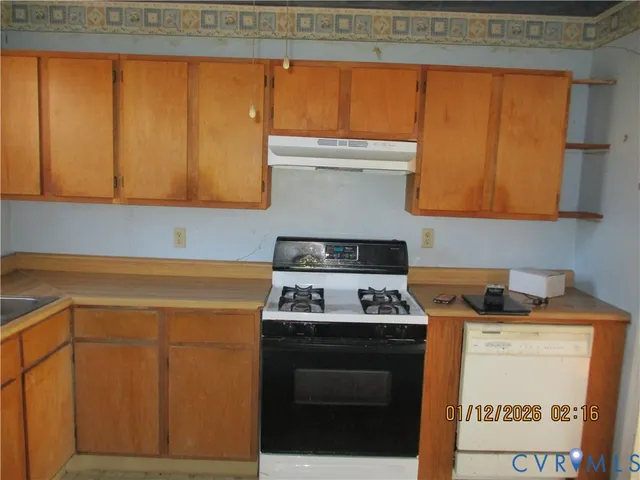 a kitchen with a stove and a microwave