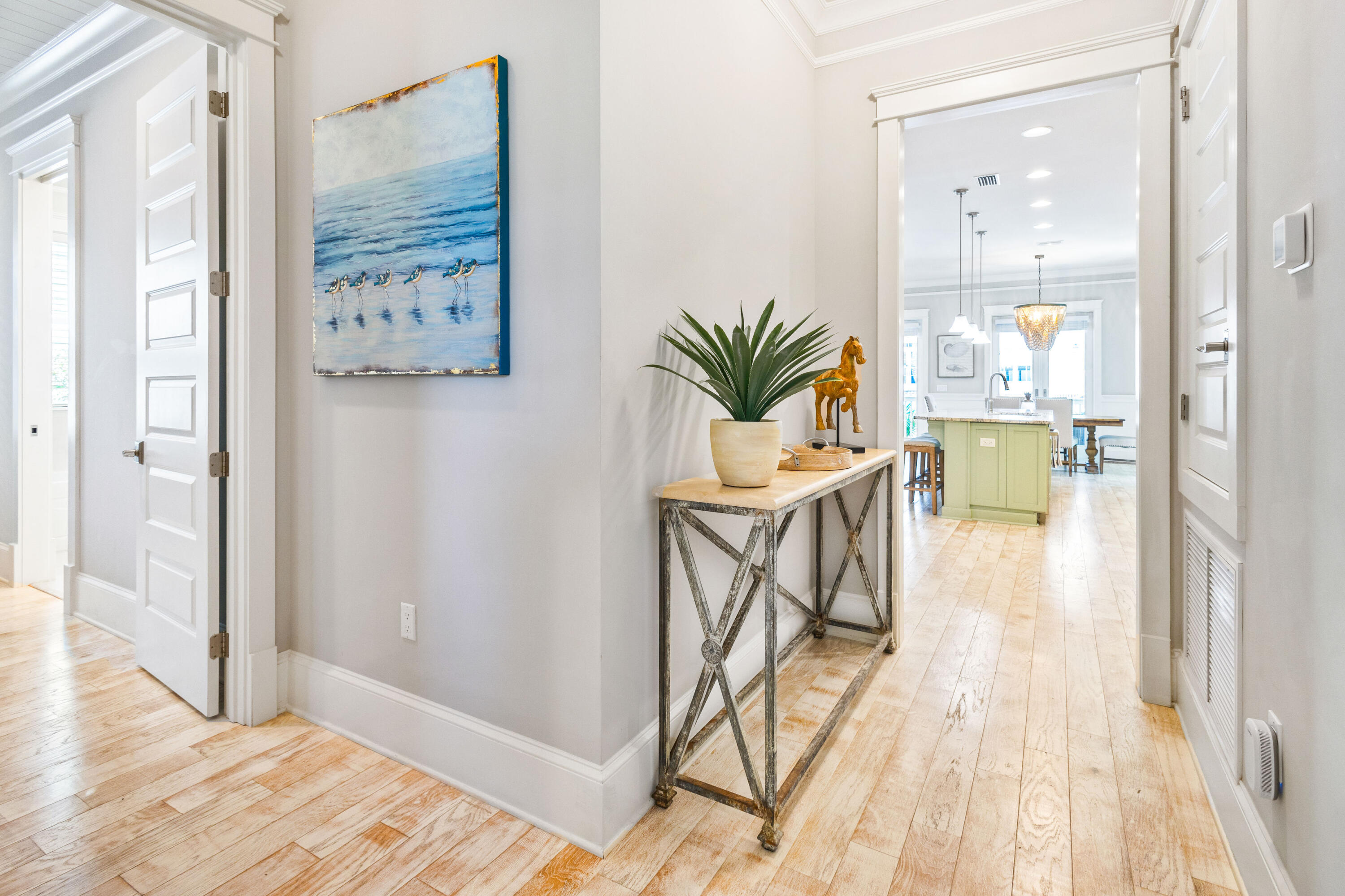 48 Pleasant Street Inlet Beach, FL 32461 - Photo 21 of 60 a view of a hallway and dining room with wooden floor