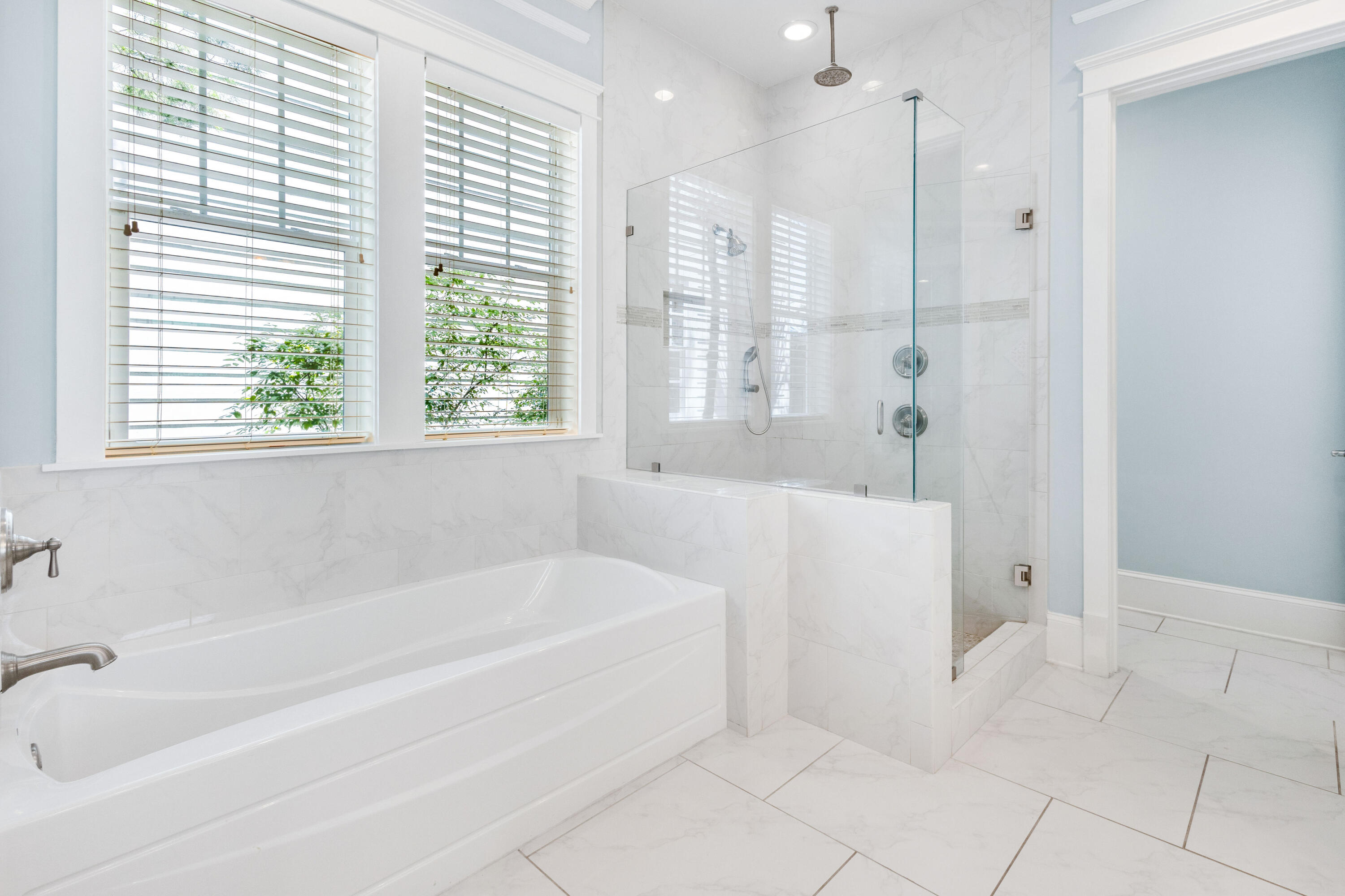 48 Pleasant Street Inlet Beach, FL 32461 - Photo 30 of 60 a white bath tub sitting in a bathroom next to a window