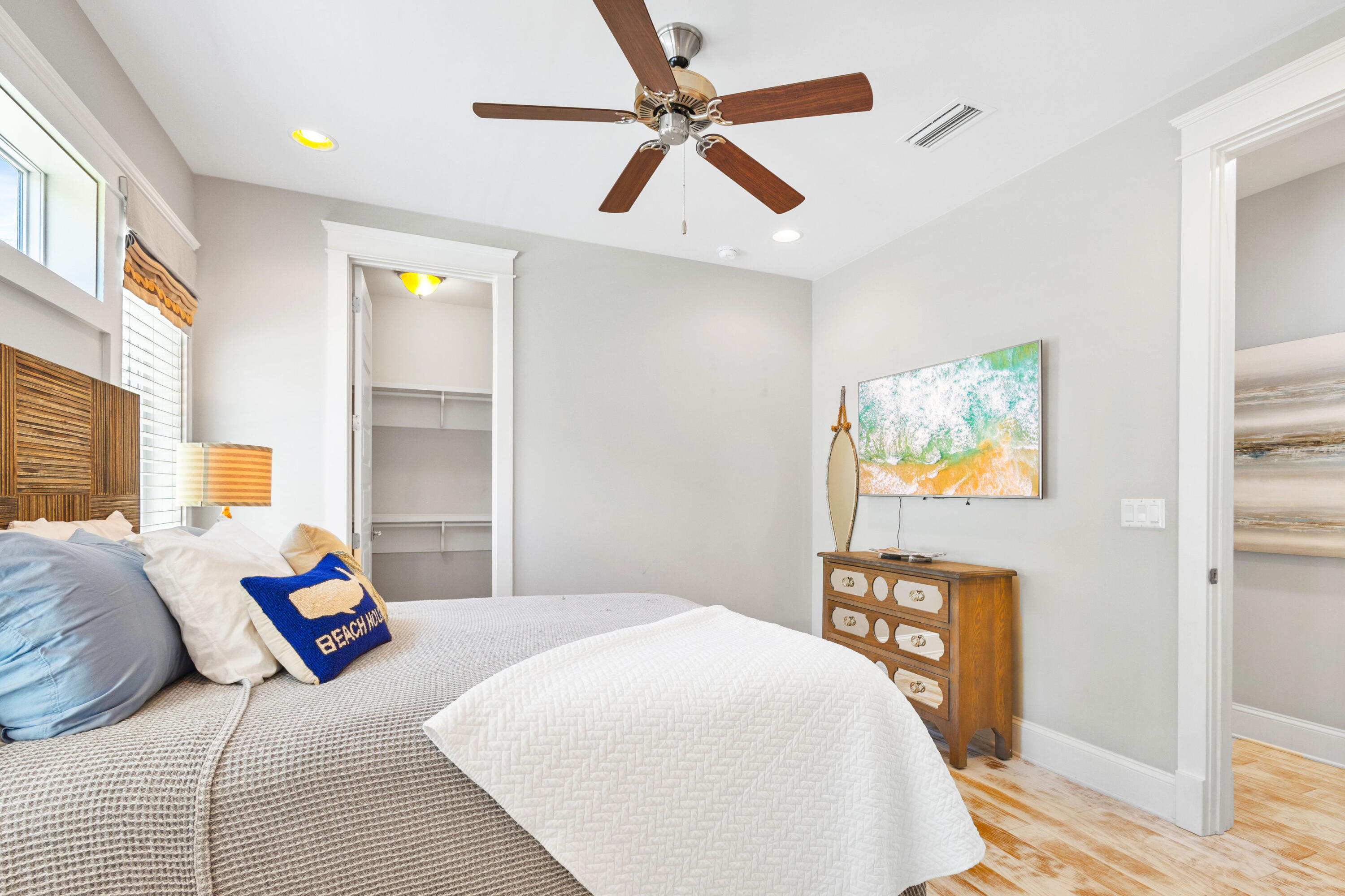 48 Pleasant Street Inlet Beach, FL 32461 - Photo 35 of 60 a bedroom with a bed and wooden floor