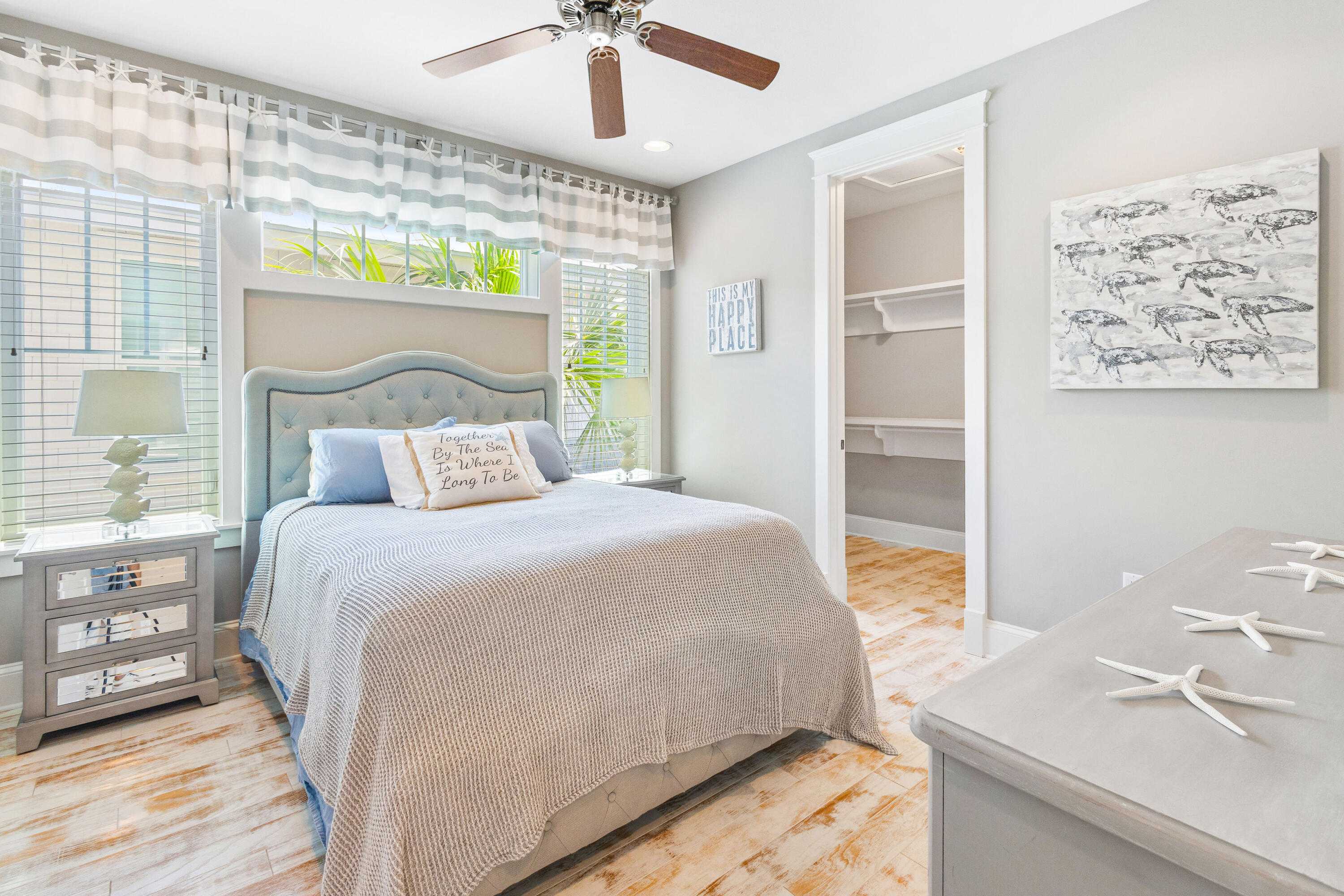 48 Pleasant Street Inlet Beach, FL 32461 - Photo 38 of 60 a bedroom with a large bed and a chandelier