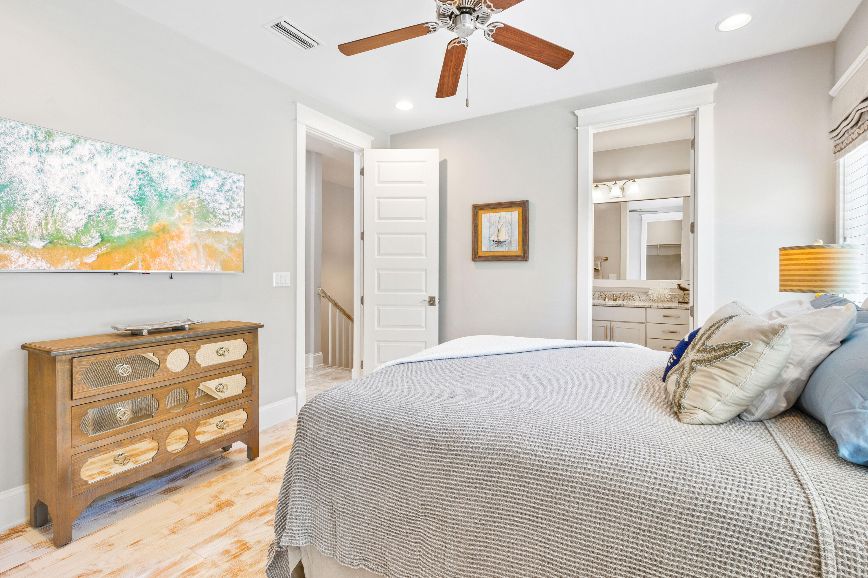 48 Pleasant Street Inlet Beach, FL 32461 - Photo 39 of 60 a bedroom with a bed and a chandelier