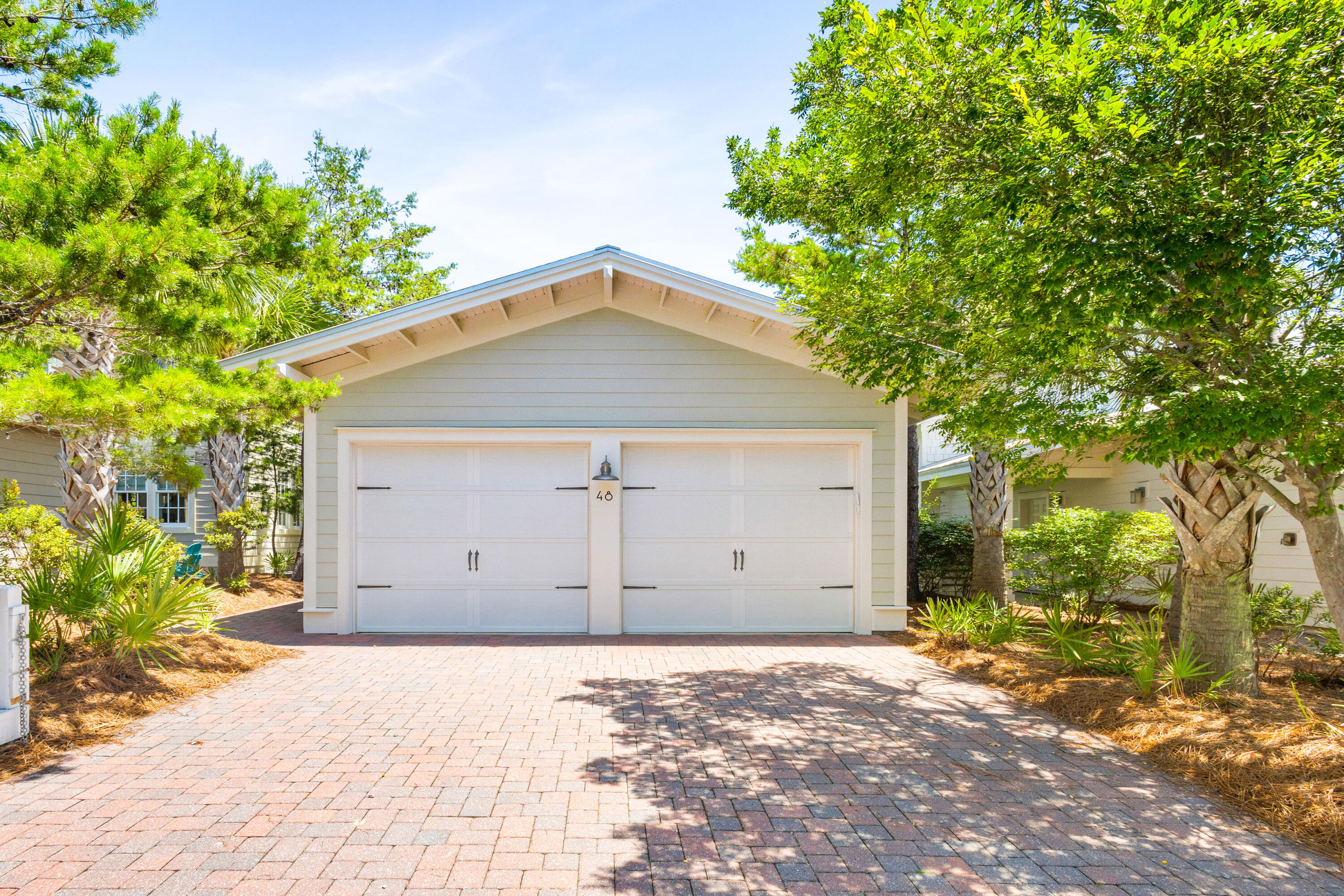48 Pleasant Street Inlet Beach, FL 32461 - Photo 47 of 60 a front view of a house with a yard and garage