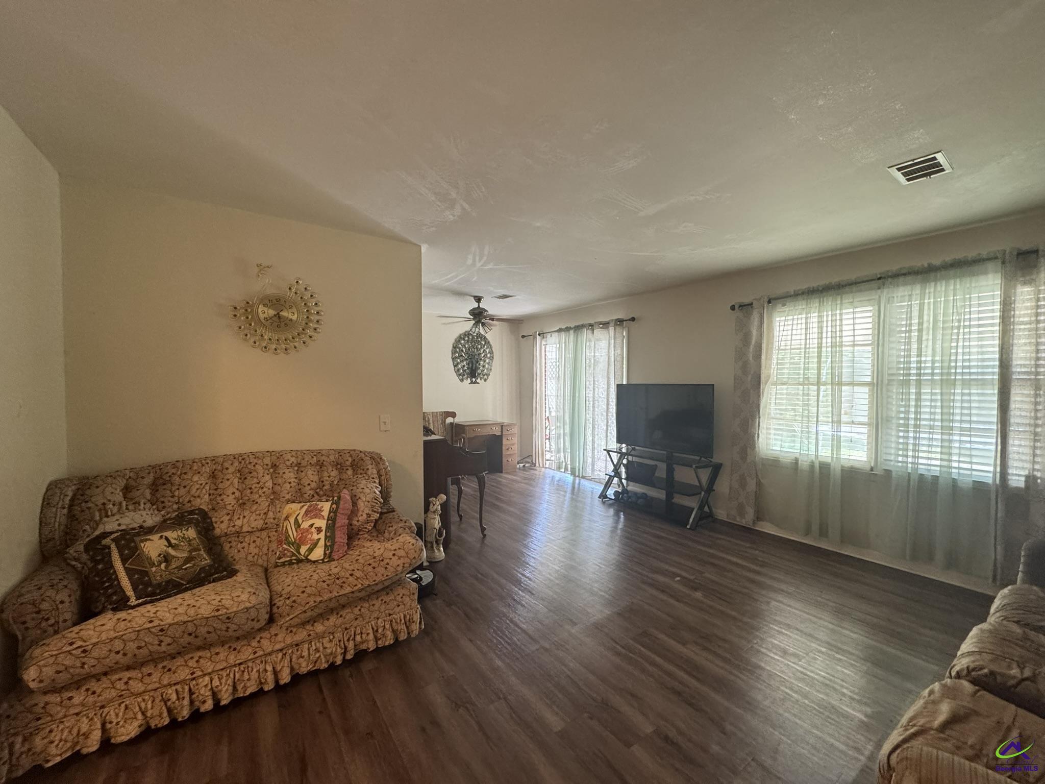 1032 Elberta Road Warner Robins, GA 31093 - Photo 21 of 26 a living room with furniture and a flat screen tv