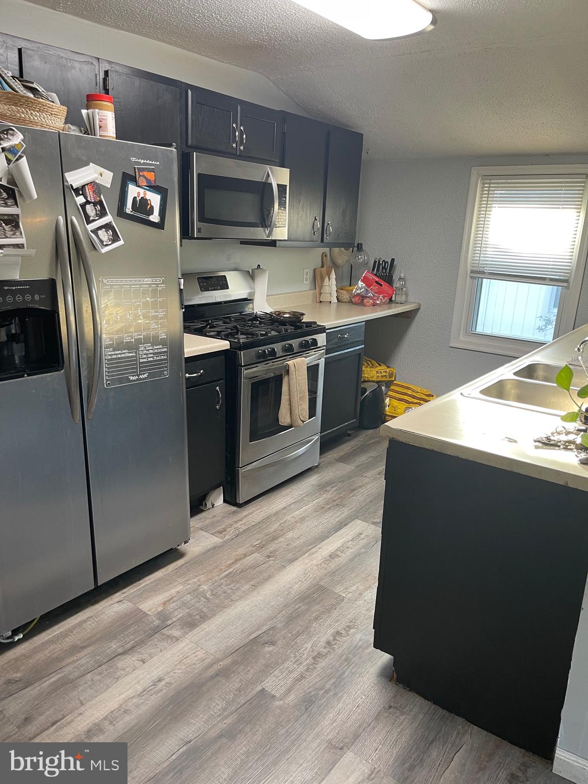 368 Pitman Avenue Pitman, NJ 08071 - Photo 15 of 22 a kitchen with stainless steel appliances granite countertop a refrigerator and a stove