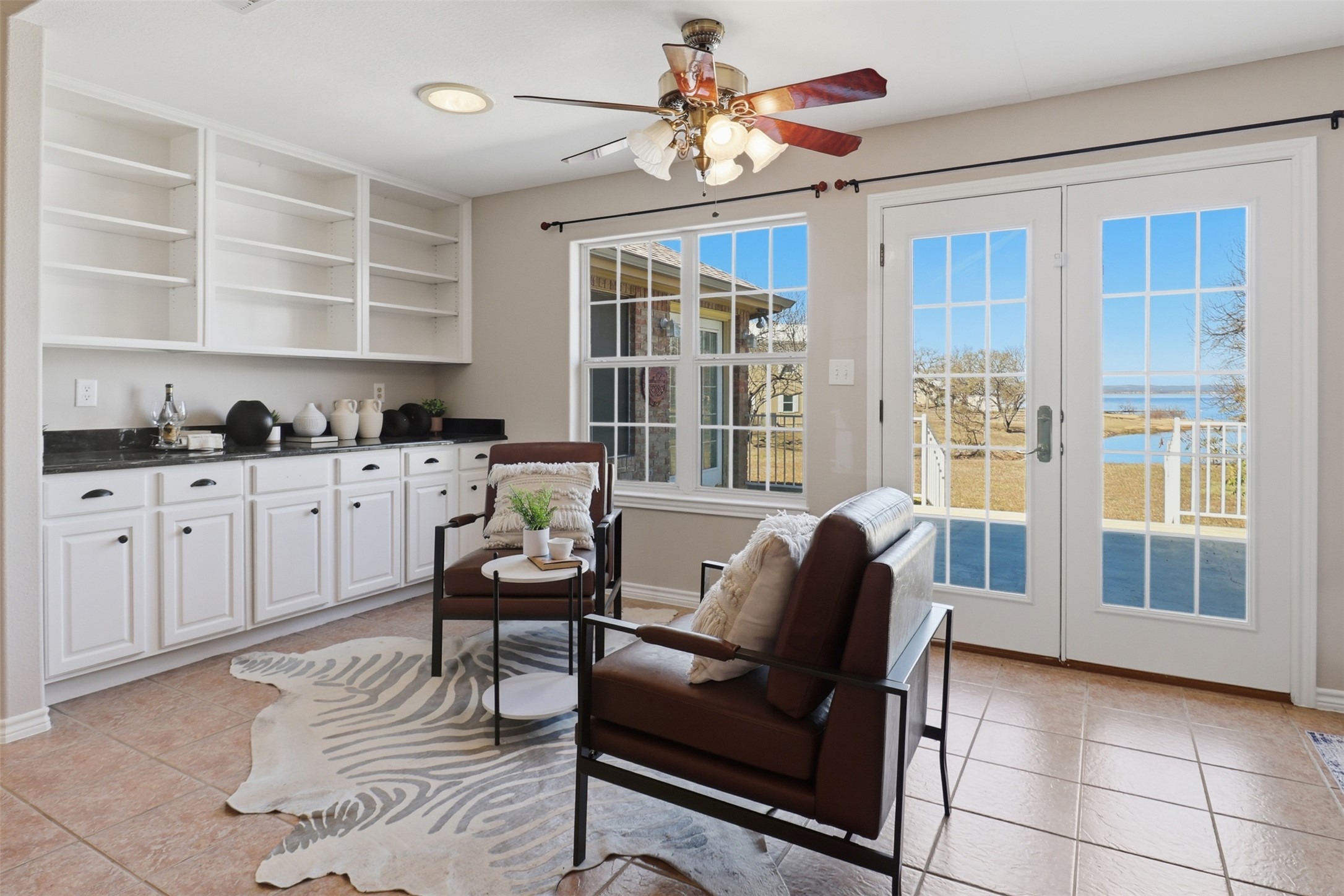 200 Apache Trail Burnet, TX 78611 - Photo 11 of 40 Sitting room featuring light tile patterned flooring, french doors, a ceiling fan, and recessed lighting