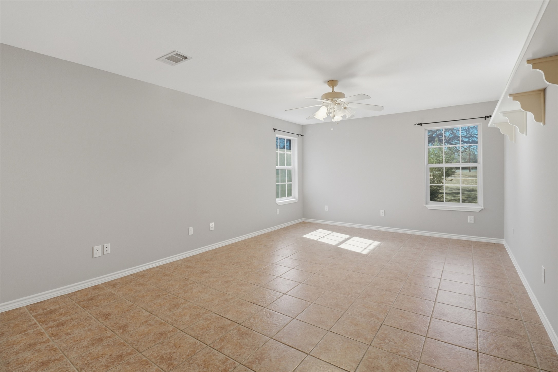 200 Apache Trail Burnet, TX 78611 - Photo 29 of 40 Spare room featuring light tile patterned floors and ceiling fan