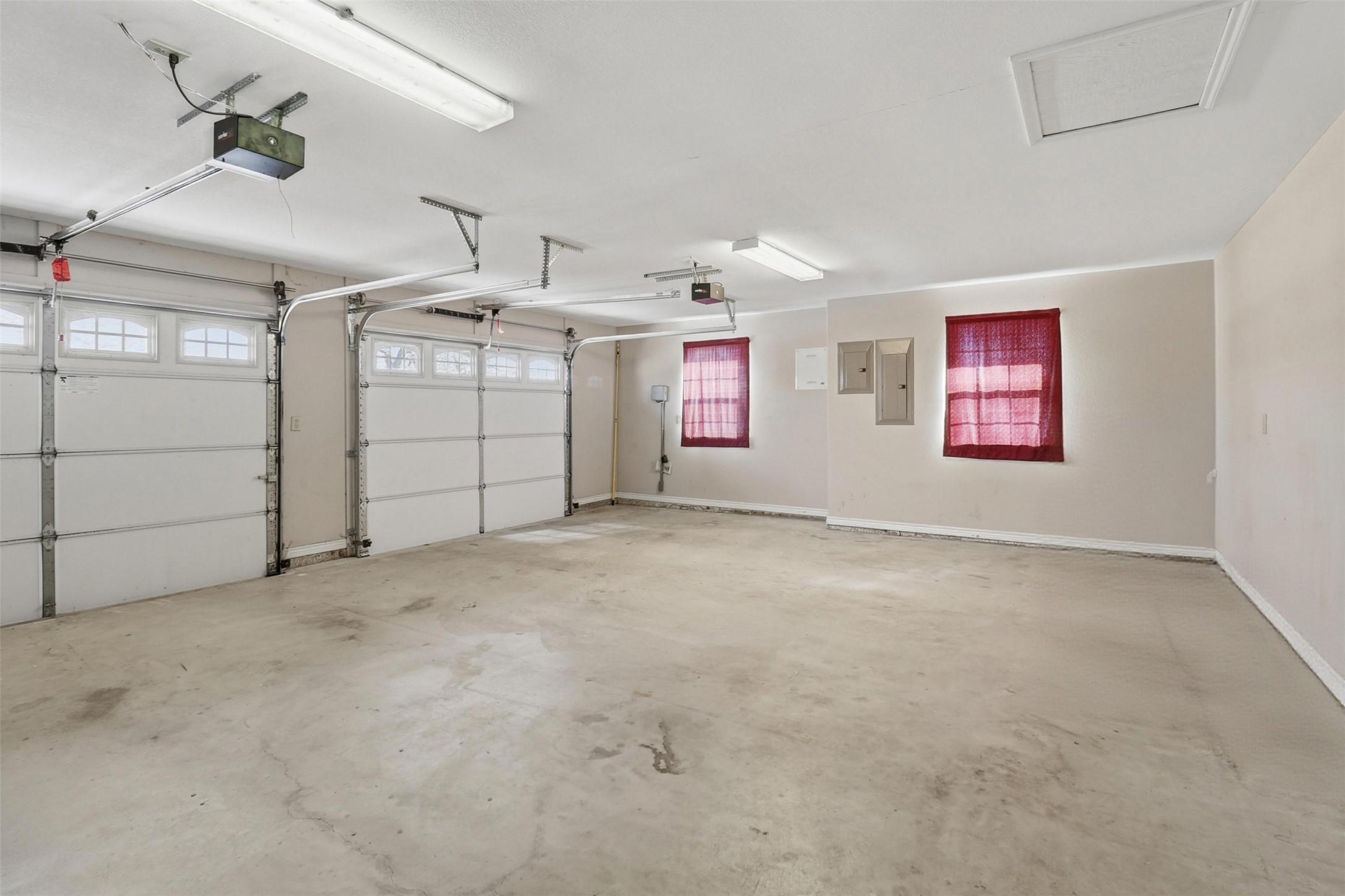 200 Apache Trail Burnet, TX 78611 - Photo 31 of 40 Garage featuring electric panel and a garage door opener