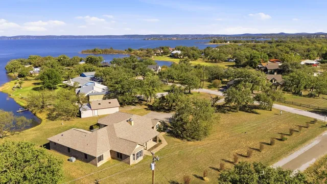 a sign board with a tree in the background