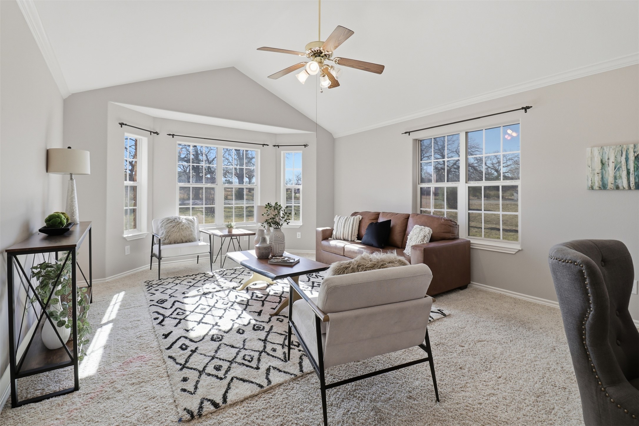 200 Apache Trail Burnet, TX 78611 - Photo 6 of 40 Living room featuring carpet, ceiling fan, vaulted ceiling, and ornamental molding