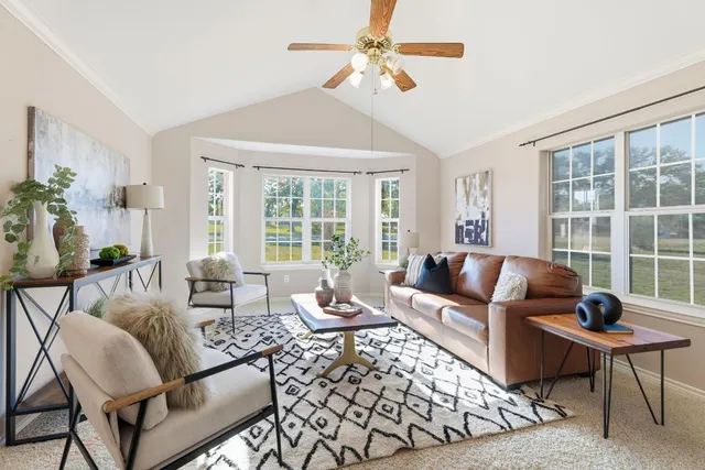 a living room with furniture and a window