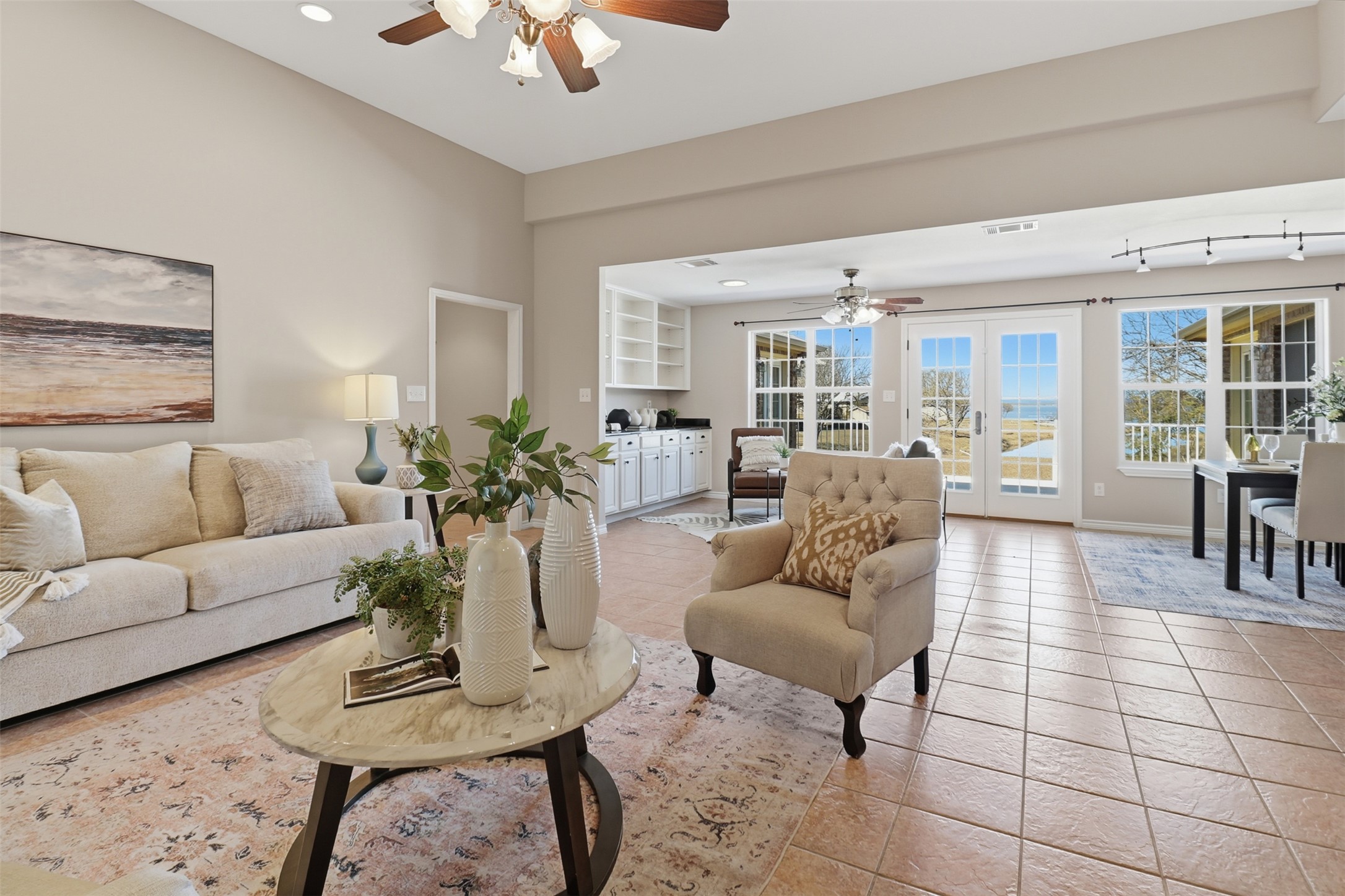 200 Apache Trail Burnet, TX 78611 - Photo 8 of 40 Living area with a ceiling fan, french doors, and light tile patterned flooring