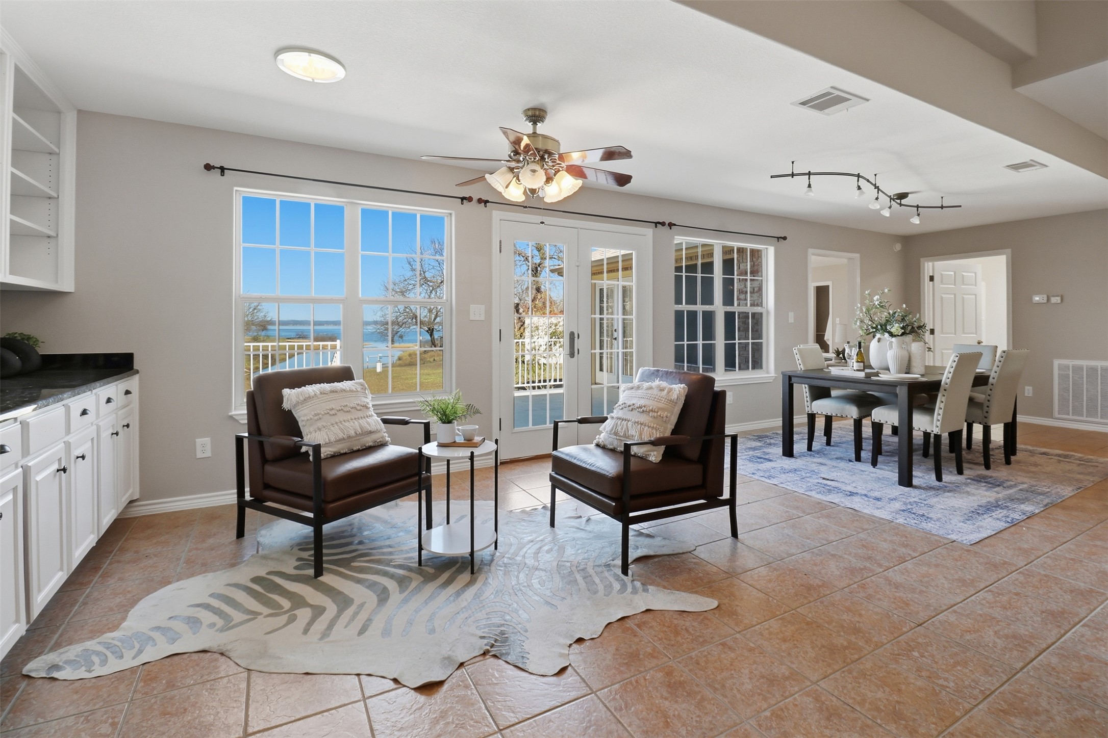 200 Apache Trail Burnet, TX 78611 - Photo 10 of 40 Sitting room with light tile patterned floors and ceiling fan