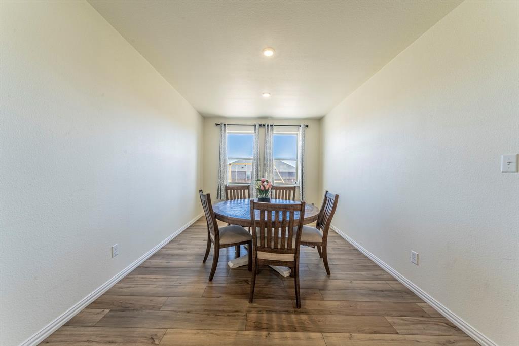 1240 Almond Road Azle, TX 76020 - Photo 8 of 26 a view of a dining room with furniture and window