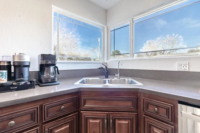 a kitchen with a sink and a window