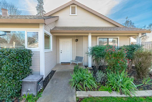 a front view of a house with garden