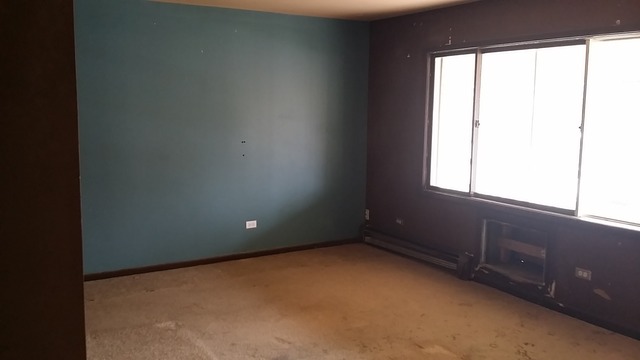 14547 Keystone Avenue, Unit 4 Midlothian, IL 60445 - Photo 5 of 8 an empty room with a window