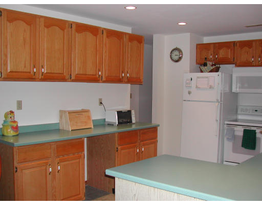 14 Charlotte Road Ipswich, MA 01938 - Photo 4 of 10 a kitchen with refrigerator cabinets and a counter top space