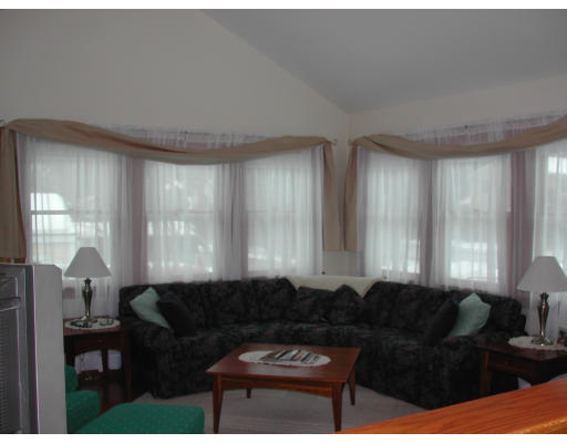 14 Charlotte Road Ipswich, MA 01938 - Photo 7 of 10 a living room with furniture and a large window