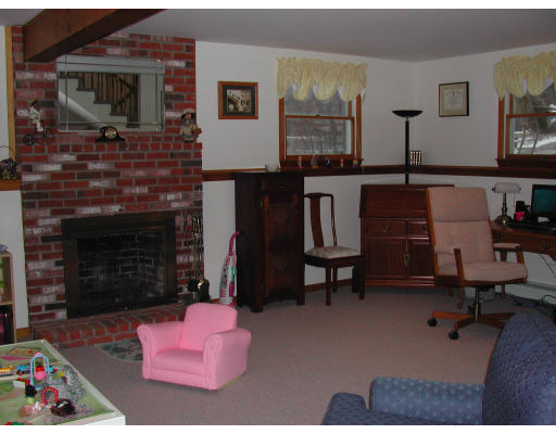 14 Charlotte Road Ipswich, MA 01938 - Photo 9 of 10 a living room with furniture and a fireplace