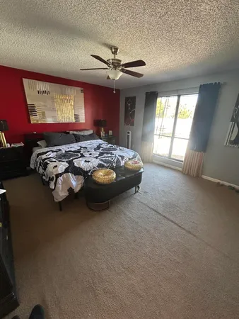a bed room with furniture and window