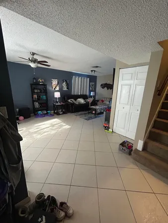 a view of a livingroom with storage and utility