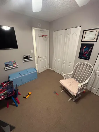 a room with furniture and a flat screen tv