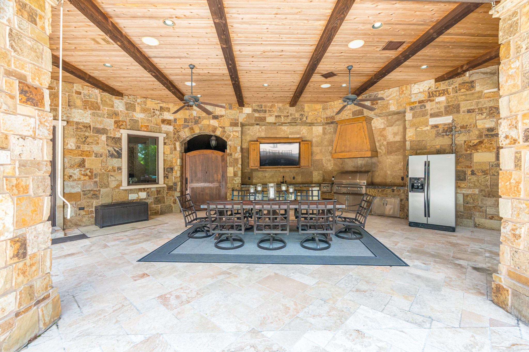 247 South Fazio Way Spring, TX 77389 - Photo 16 of 17 An entertainer's dream, this extensive covered pavilion features a fully equipped outdoor kitchen, dining area, soaring wood-beamed ceilings, and ample space for hosting family and friends year-round.