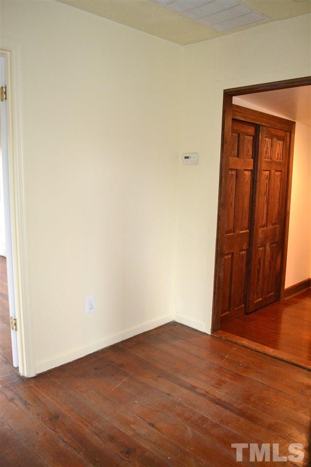 10769 Beaver Dam Road Middlesex, NC 27557 - Photo 13 of 14 an empty room with wooden floor