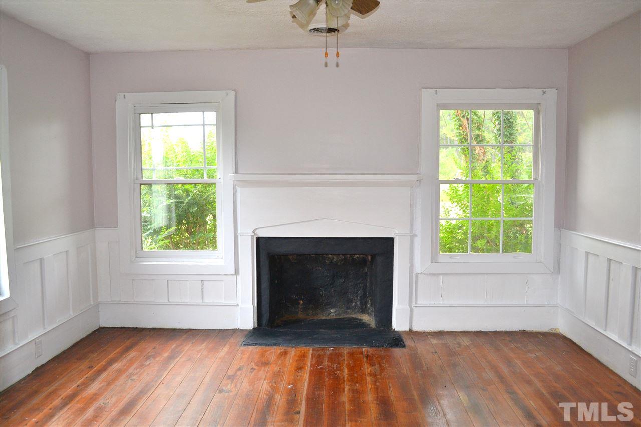 10769 Beaver Dam Road Middlesex, NC 27557 - Photo 14 of 14 a view of empty room with a fireplace and a window