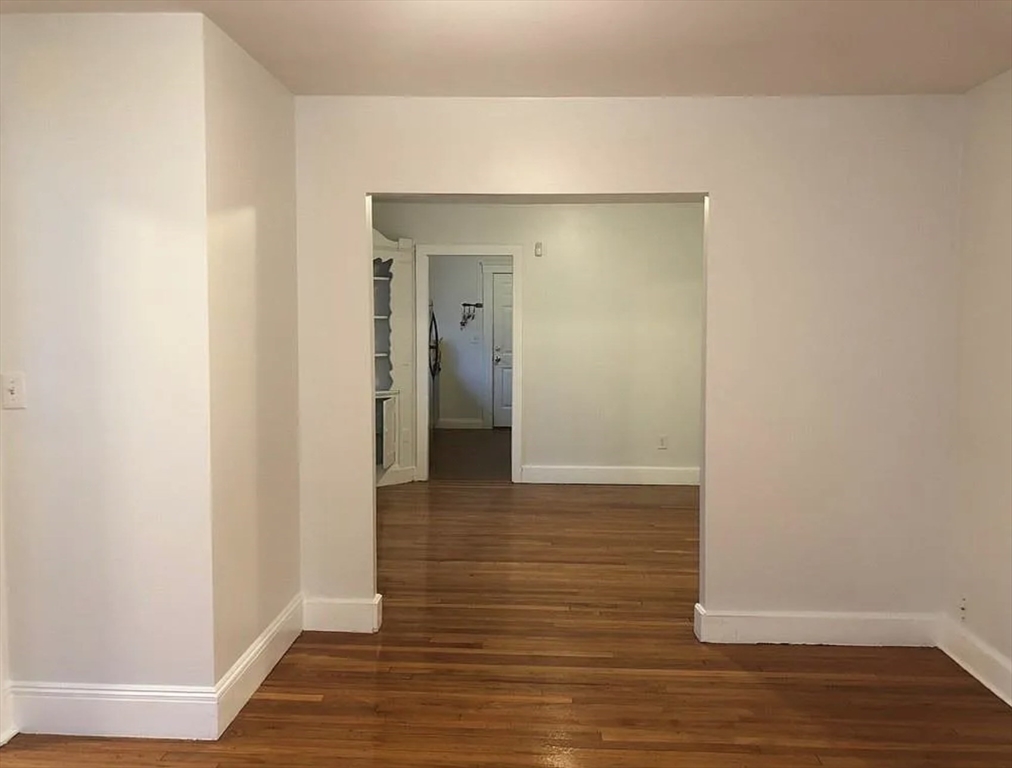 124 Selden Street Boston, MA 02124 - Photo 15 of 35 a view of a hallway with wooden floor