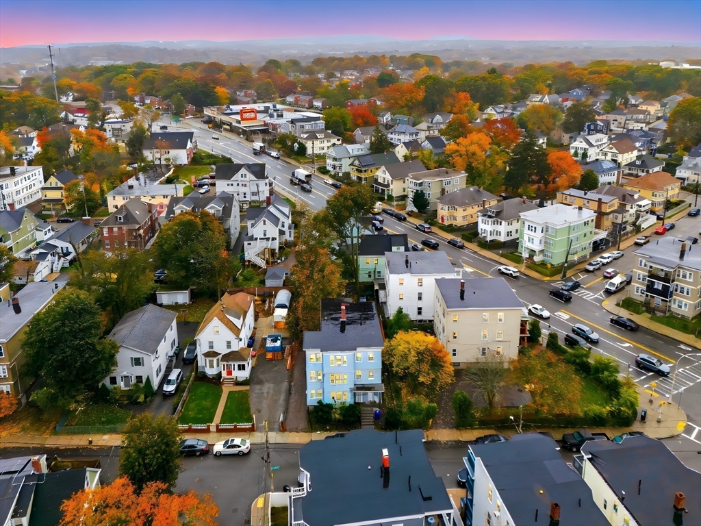124 Selden Street Boston, MA 02124 - Photo 3 of 35 an aerial view of residential houses with outdoor space