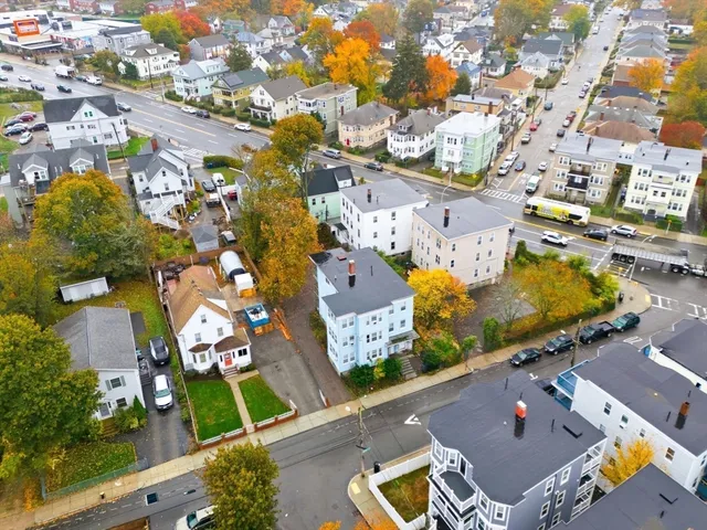 an aerial view of residential houses with outdoor space
