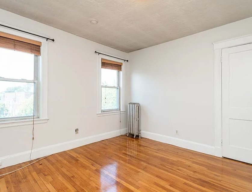 124 Selden Street Boston, MA 02124 - Photo 9 of 35 an empty room with a window