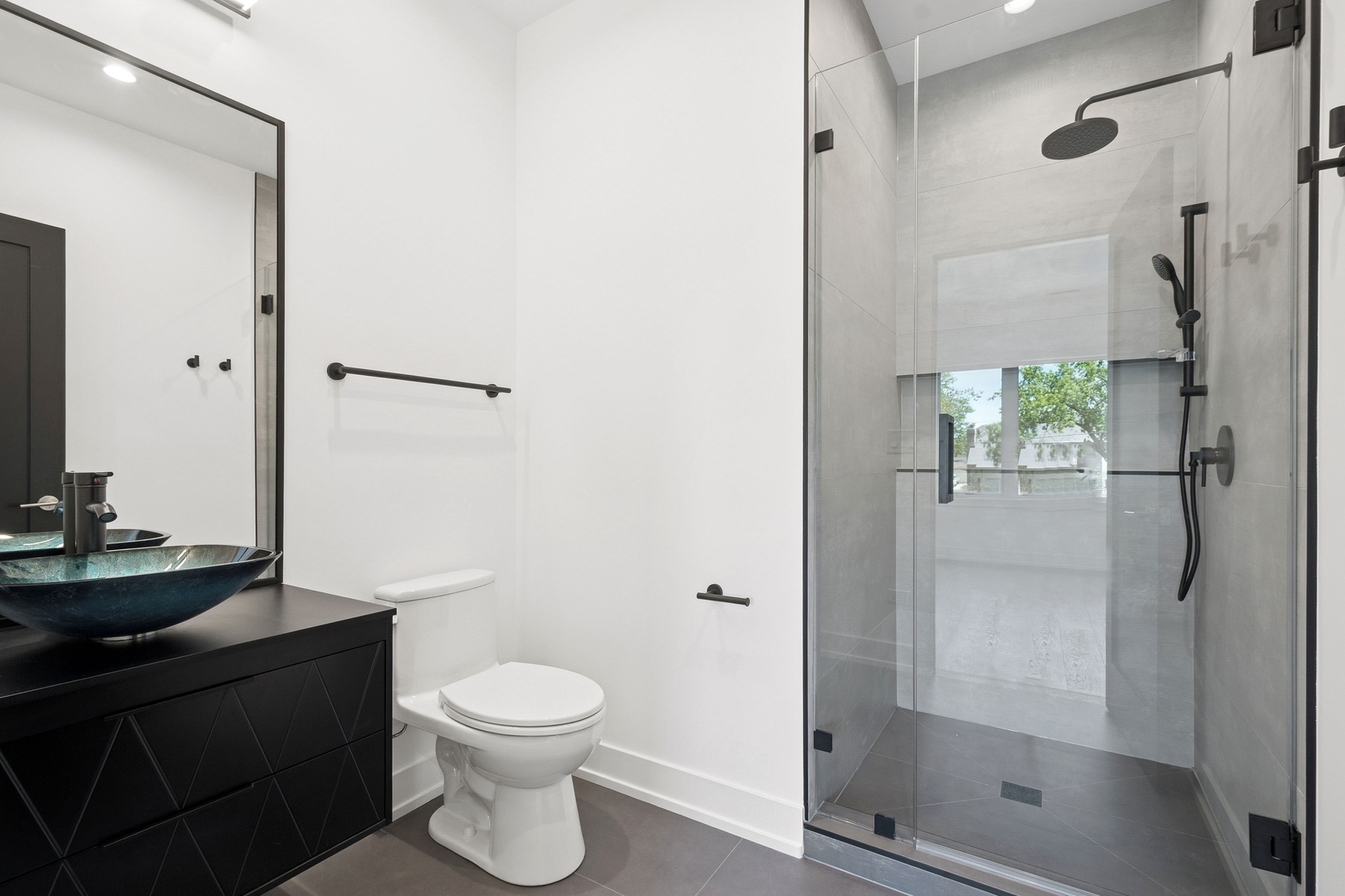 9214 Washington Street Niles, IL 60714 - Photo 19 of 33 a bathroom with a toilet a sink and shower