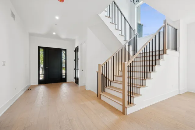 a view of a hallway with stairs