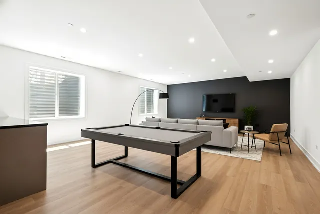 a view of a livingroom with furniture and a flat screen tv