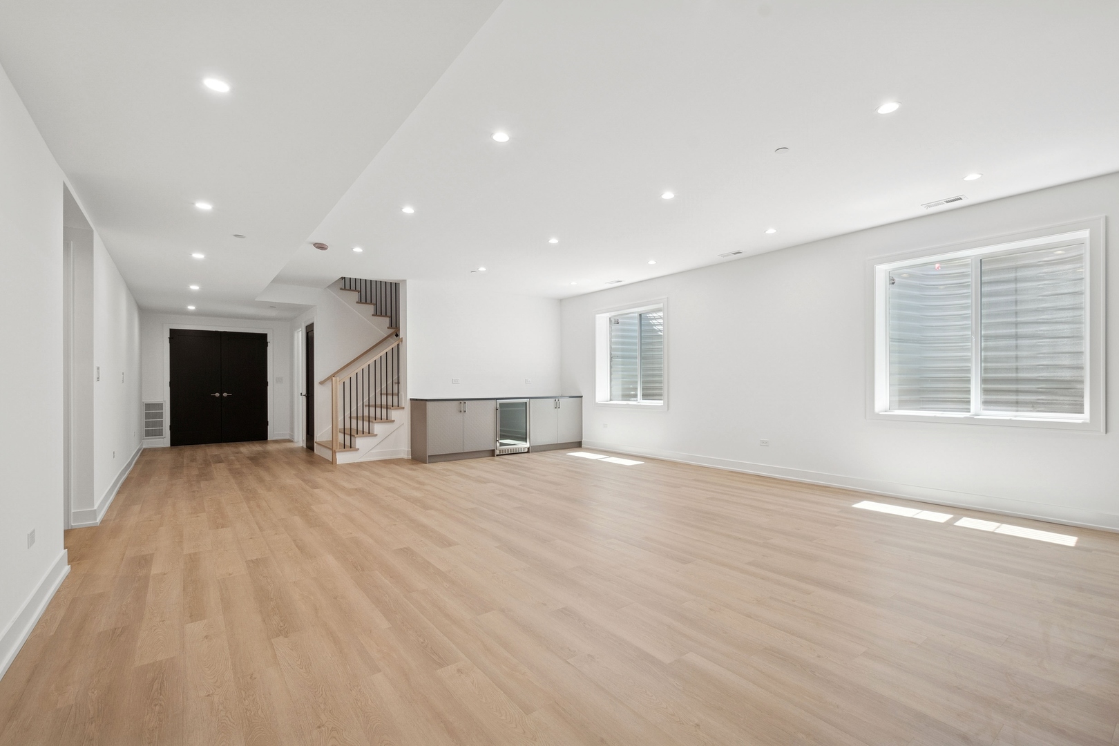 9214 Washington Street Niles, IL 60714 - Photo 25 of 33 an empty room with wooden floor and windows