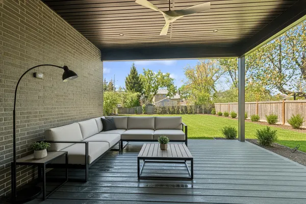 a picture of a bench in front of a wall