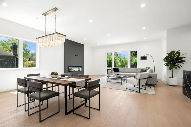 a living room with furniture a window and a table