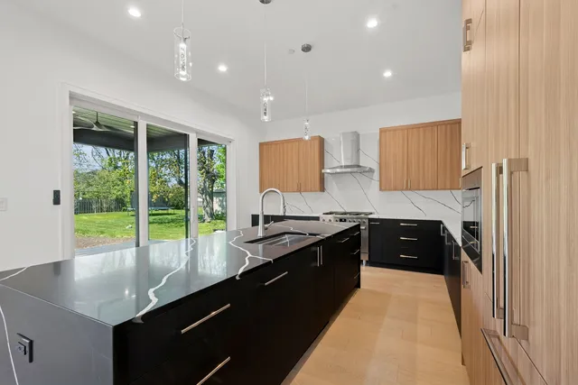 a kitchen with a sink stove and cabinets