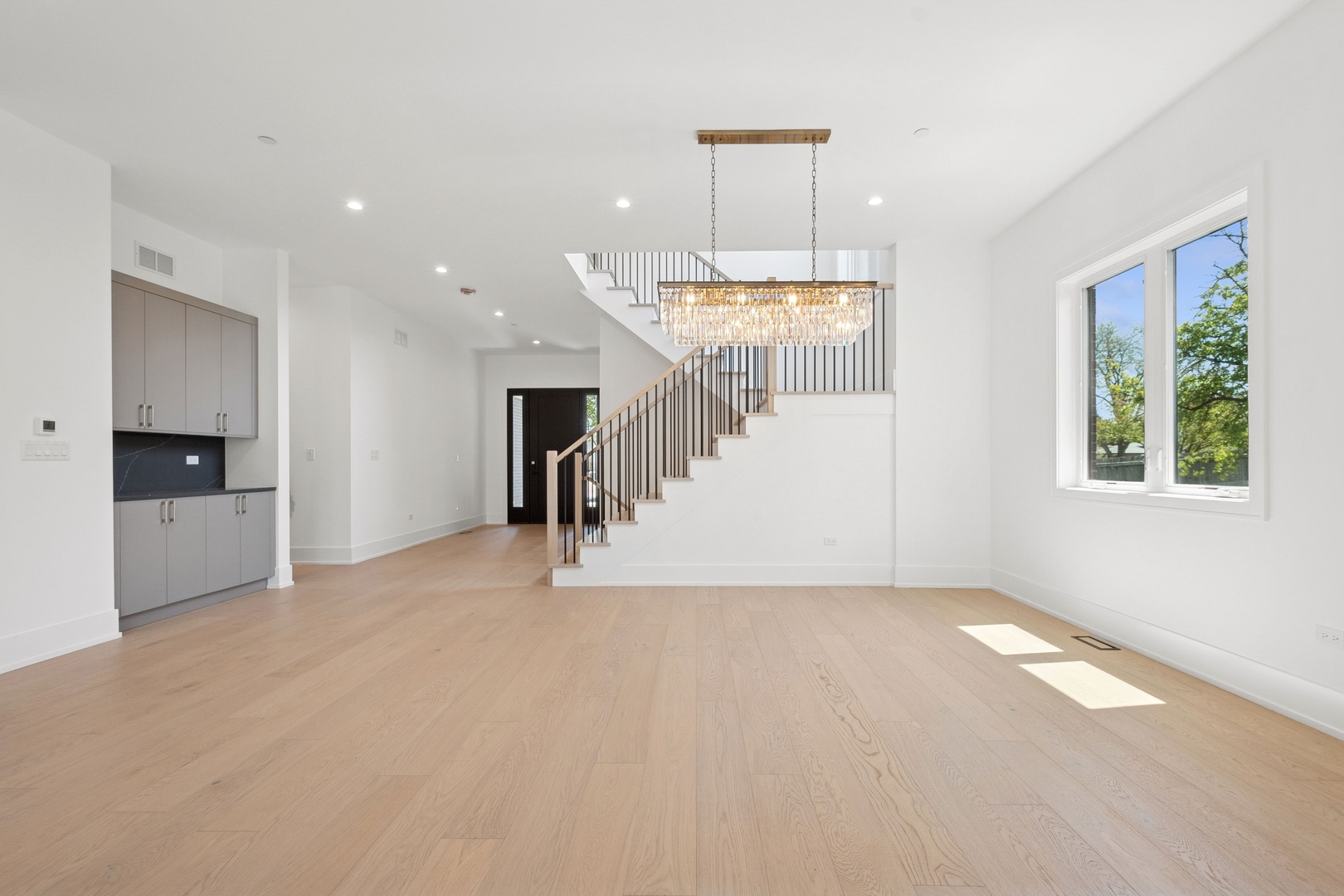 9214 Washington Street Niles, IL 60714 - Photo 9 of 33 a view of empty room with a window and chandelier