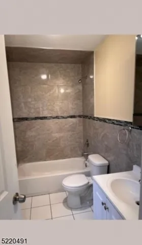 a bathroom with a bathtub and toilet