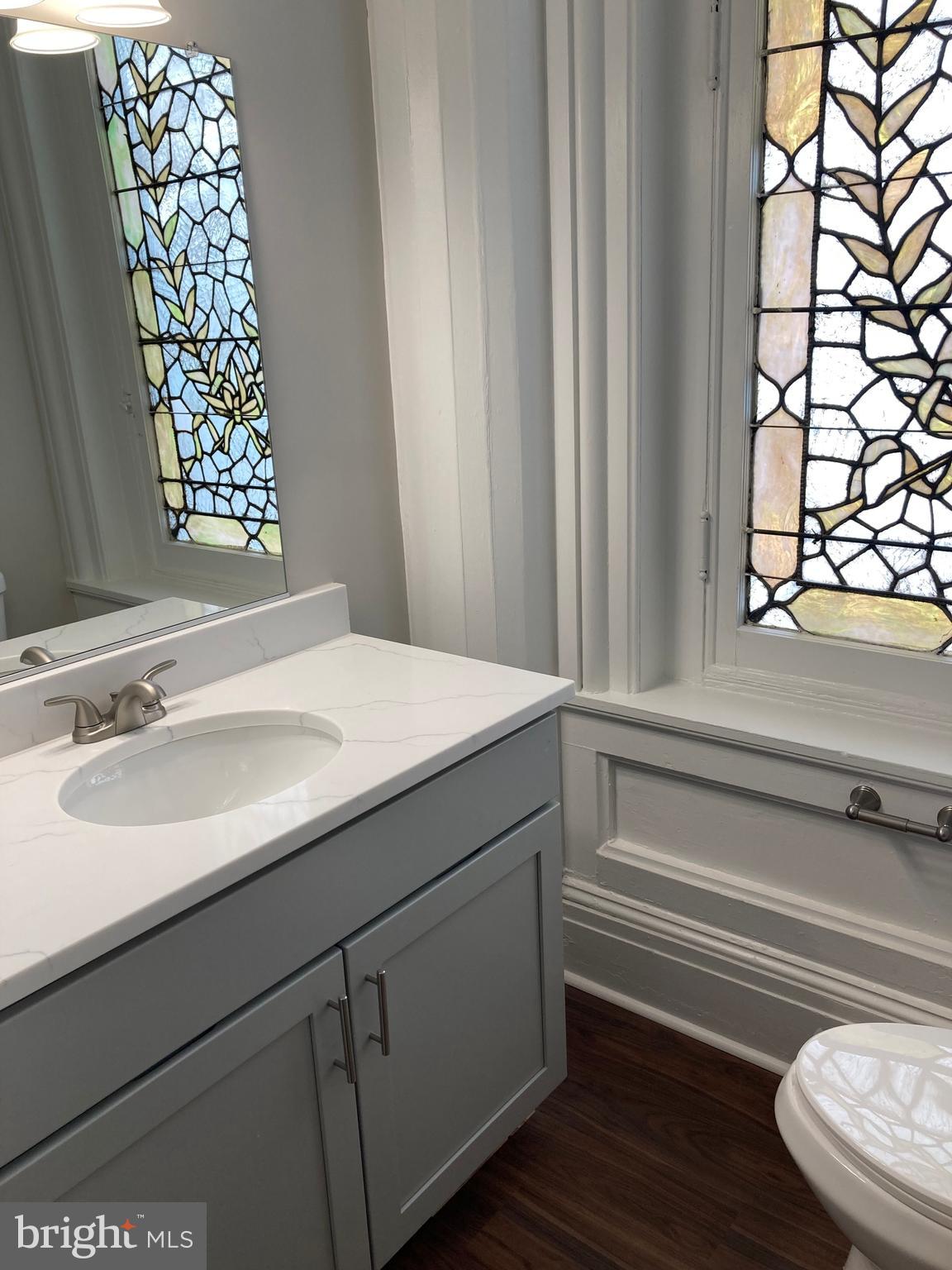 10 East Chase Street Baltimore, MD 21202 - Photo 12 of 60 a bathroom with a sink and a mirror