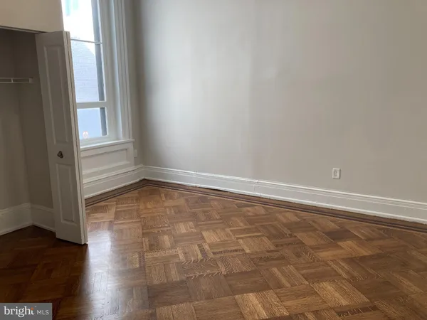 a view of bedroom with wooden floor