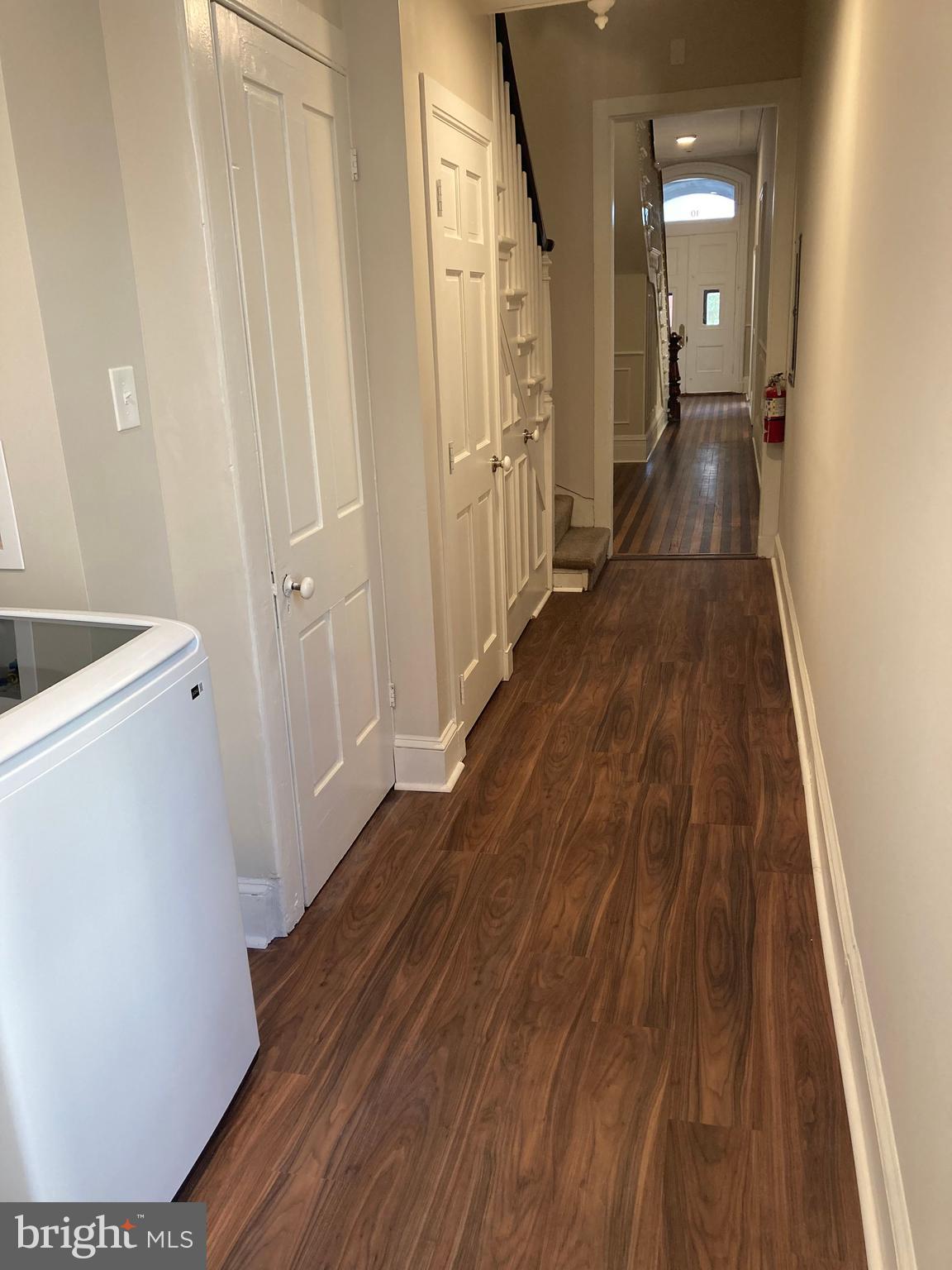 10 East Chase Street Baltimore, MD 21202 - Photo 20 of 60 a view of a hallway with wooden floor