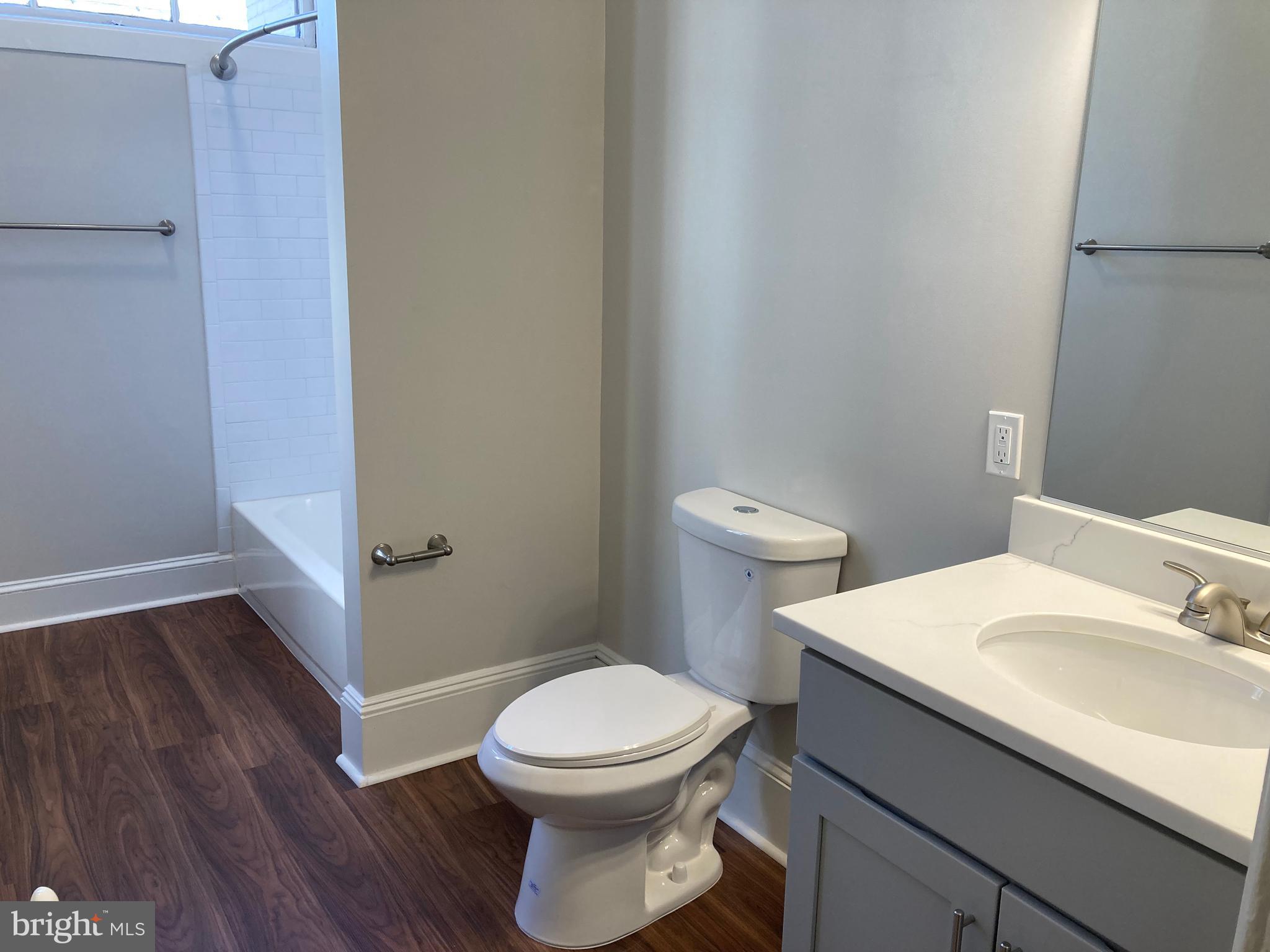 10 East Chase Street Baltimore, MD 21202 - Photo 33 of 60 a bathroom with a sink and a toilet
