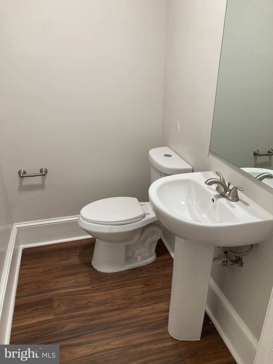 10 East Chase Street Baltimore, MD 21202 - Photo 37 of 60 a bathroom with a sink and a toilet