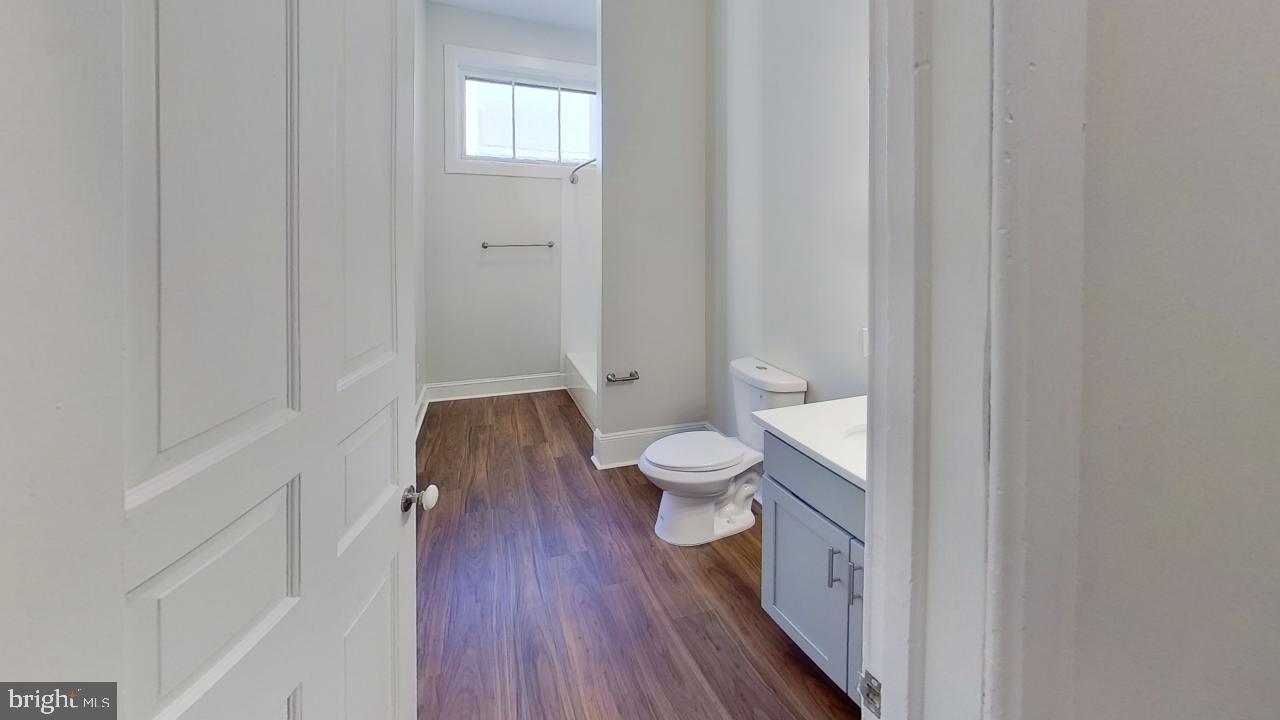 10 East Chase Street Baltimore, MD 21202 - Photo 41 of 60 a bathroom with a toilet and a shower