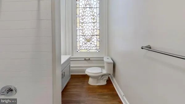 a view of an empty room and a window